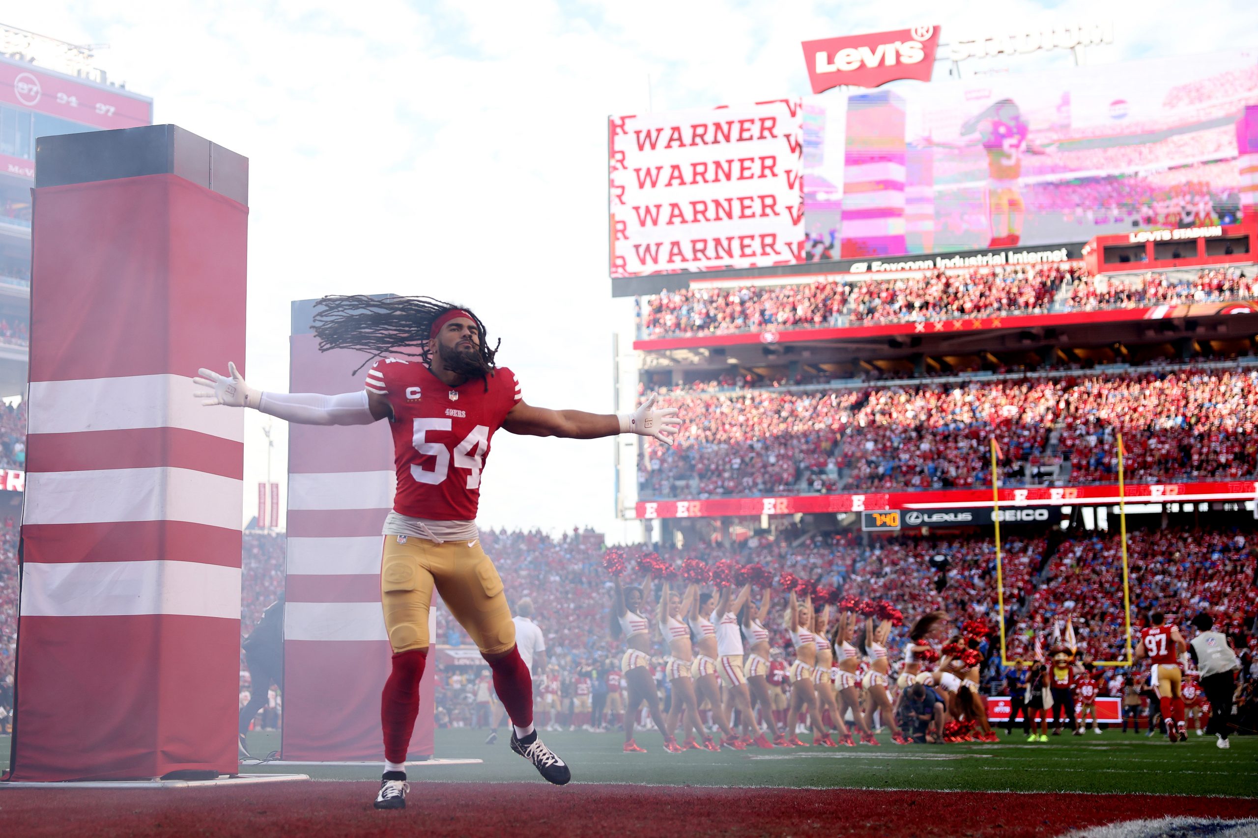Fred Warner #54 of the San Francisco 49ers runs onto the field for their game against the Detroit L...