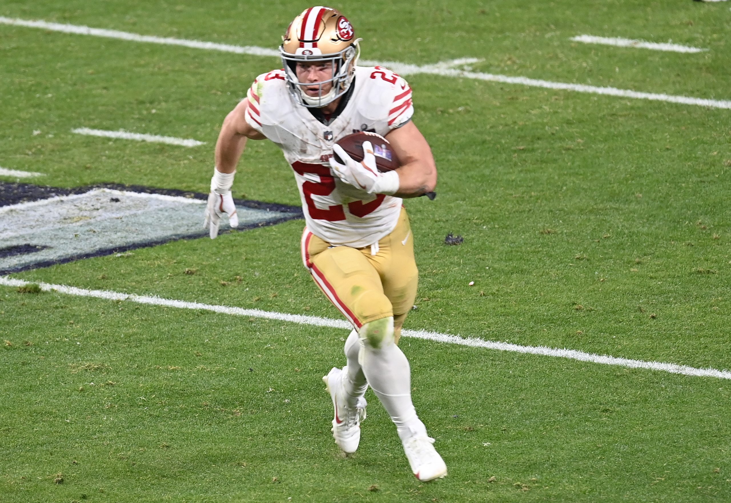 Christian McCaffrey #23 of the San Francisco 49ers carries the ball against the Kansas City Chiefs ...