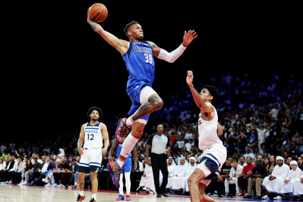 ABU DHABI, UNITED ARAB EMIRATES - OCTOBER 07: Dexter Dennis #38 of the Dallas Mavericks dunks the b...