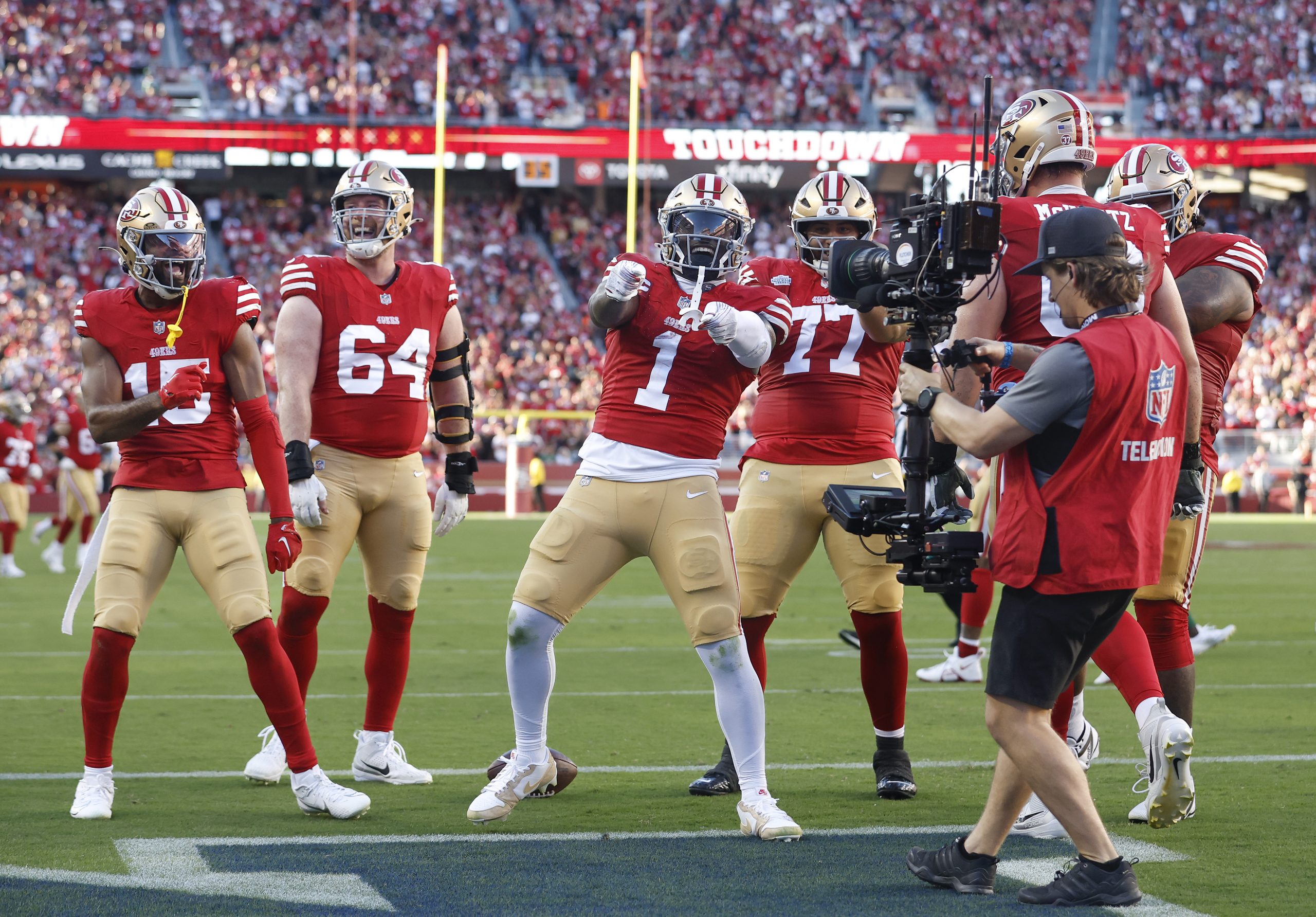 Wide receiver Deebo Samuel Sr. #1 of the San Francisco 49ers celebrates with touchdown with teammat...