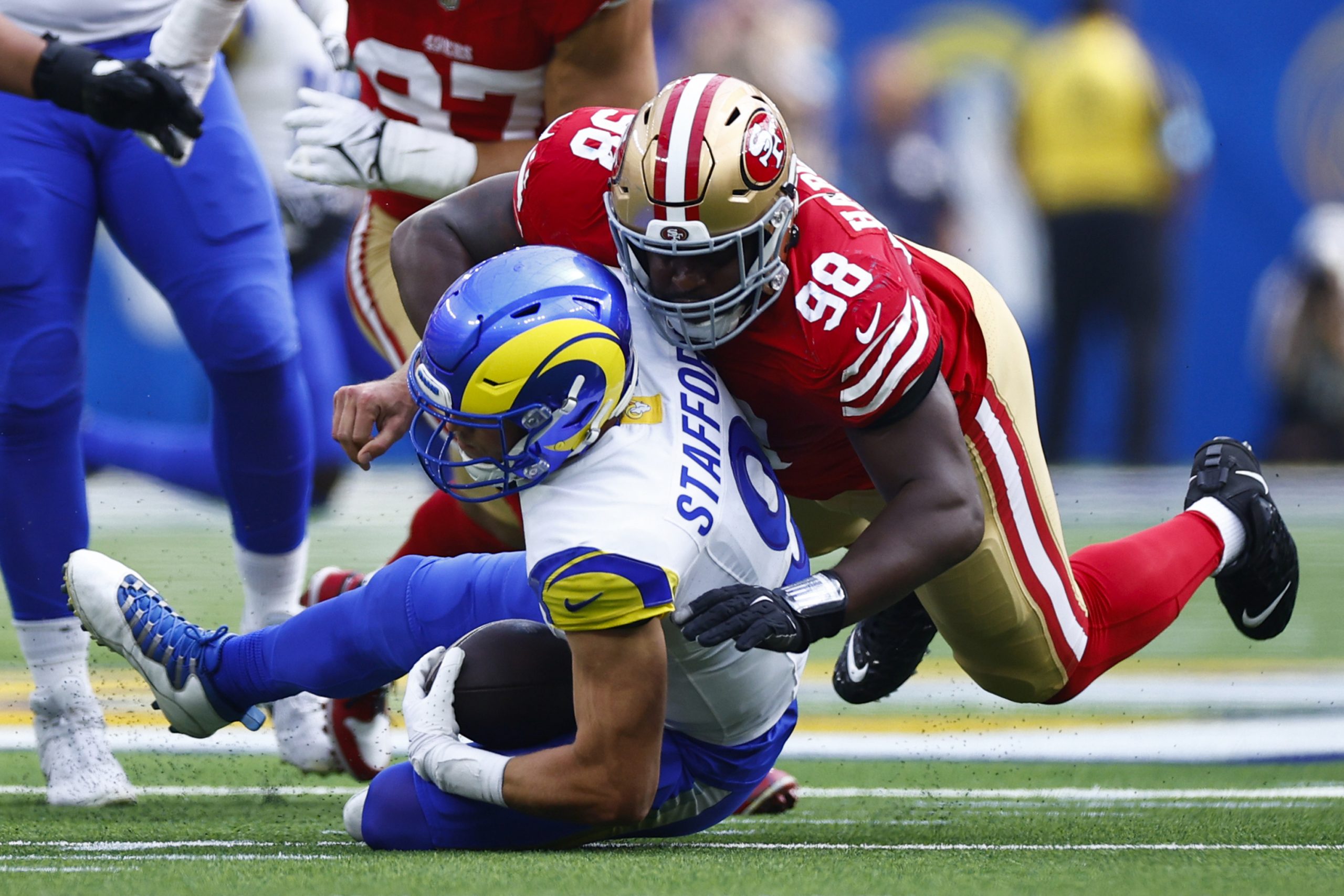 Javon Hargrave #98 of the San Francisco 49ers sacks quarterback Matthew Stafford #9 of the Los Ange...