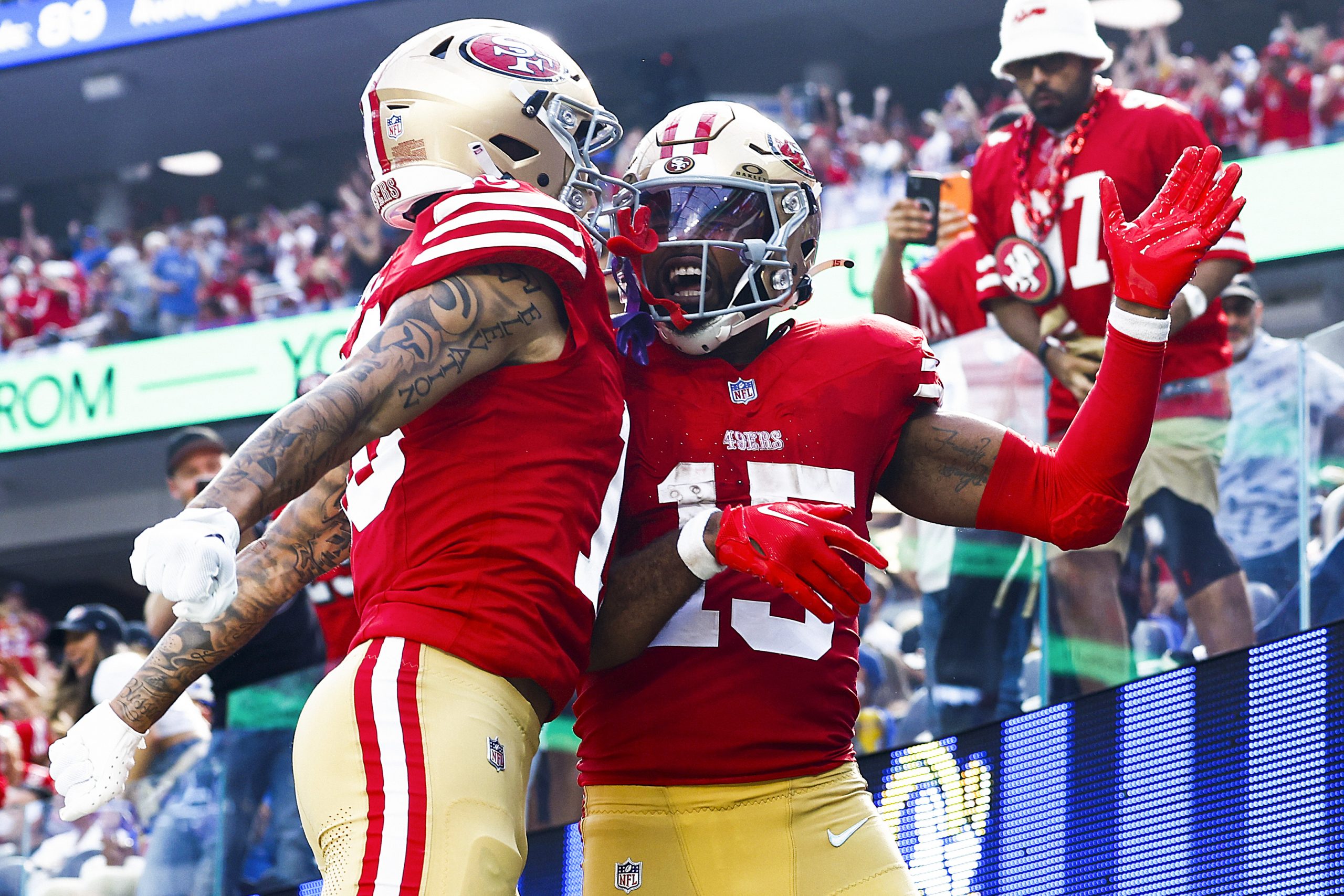 Jauan Jennings #15 of the San Francisco 49ers celebrates a touchdown with teammate Ronnie Bell #10 ...