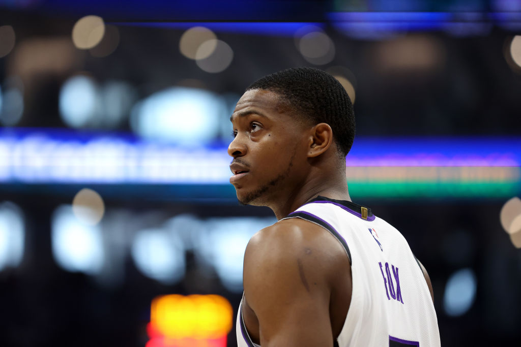 SACRAMENTO, CALIFORNIA - APRIL 16: De'Aaron Fox #5 of the Sacramento Kings stands on the court duri...