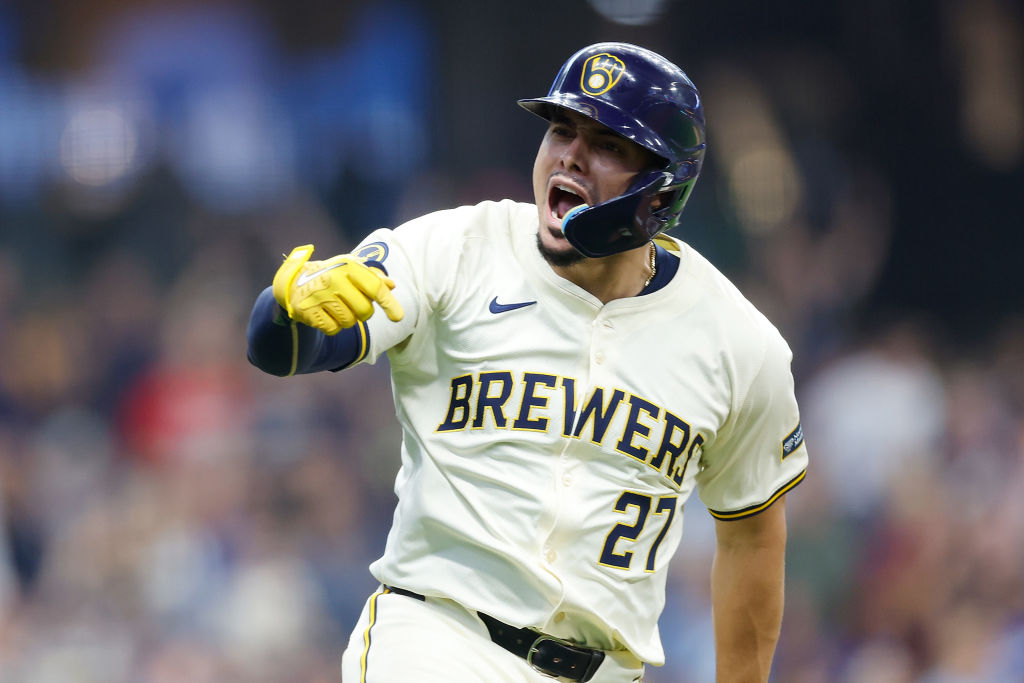 MILWAUKEE, WISCONSIN - AUGUST 15: Willy Adames #27 of the Milwaukee Brewers reacts toward the bench...