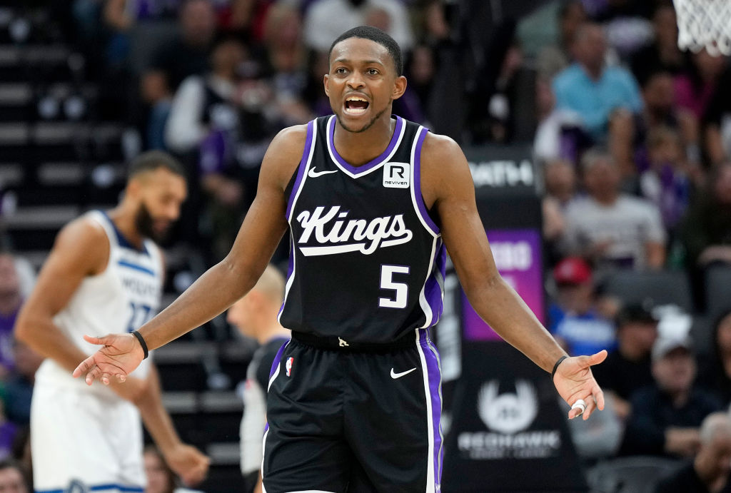 SACRAMENTO, CALIFORNIA - OCTOBER 24: De'Aaron Fox #5 of the Sacramento Kings reacts after he was ca...