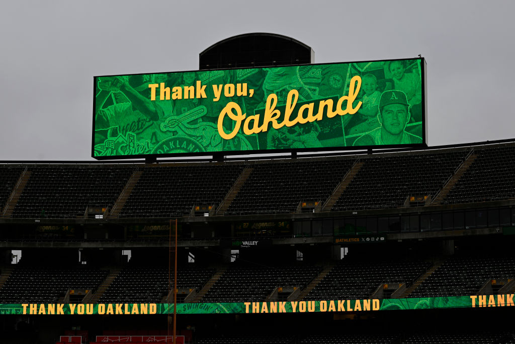 OAKLAND, CALIFORNIA - SEPTEMBER 26: A general view of the stadium signs before the Oakland Athletic...