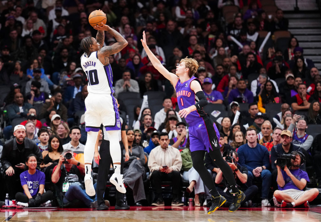 TORONTO, ON - NOVEMBER 2: DeMar DeRozan #10 of the Sacramento Kings shoots against Gradey Dick #1 o...