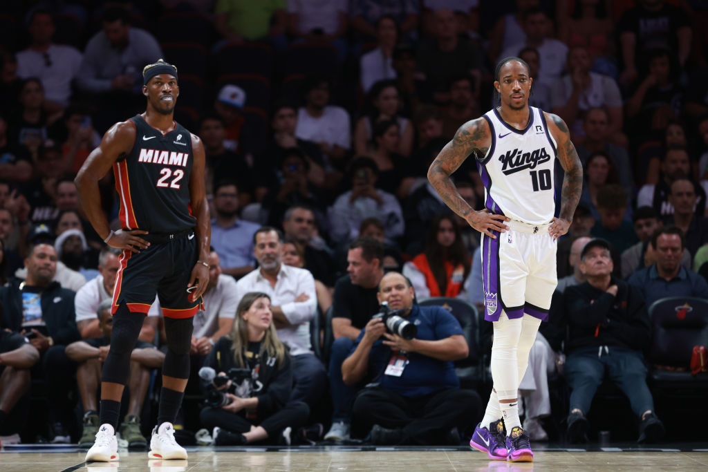 MIAMI, FLORIDA - NOVEMBER 04: DeMar DeRozan #10 of the Sacramento Kings stands alongside Jimmy Butl...