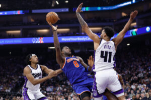 SACRAMENTO, CALIFORNIA - MARCH 10: OG Anunoby #8 of the New York Knicks shoots the ball against Trey Lyles #41 of the Sacramento Kings in the first half at Golden 1 Center on March 10, 2025 in Sacramento, California. NOTE TO USER: User expressly acknowledges and agrees that, by downloading and or using this photograph, User is consenting to the terms and conditions of the Getty Images License Agreement. (Photo by Lachlan Cunningham/Getty Images)