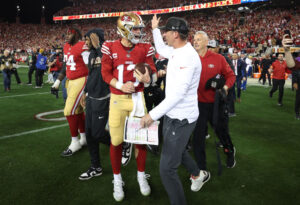 SANTA CLARA, CALIFORNIA - JANUARY 28: Brock Purdy #13 of the San Francisco 49ers celebrates with Head coach Kyle Shanahan after defeating the Detroit Lions 34-31 in the NFC Championship Game at Levi's Stadium on January 28, 2024 in Santa Clara, California. (Photo by Ezra Shaw/Getty Images)