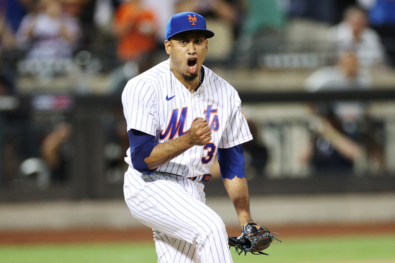 NEW YORK, NEW YORK - AUGUST 13: Edwin Diaz #39 of the New York Mets reacts after pitching the final...