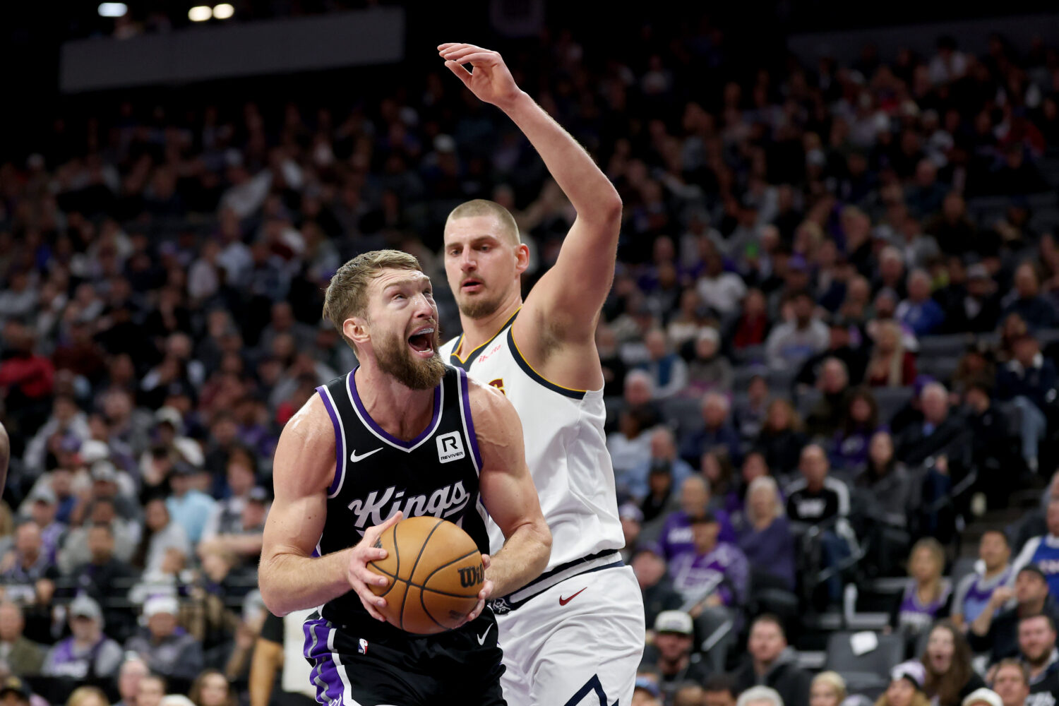 SACRAMENTO, CALIFORNIA - DECEMBER 16: Domantas Sabonis #11 of the Sacramento Kings goes up for a sh...