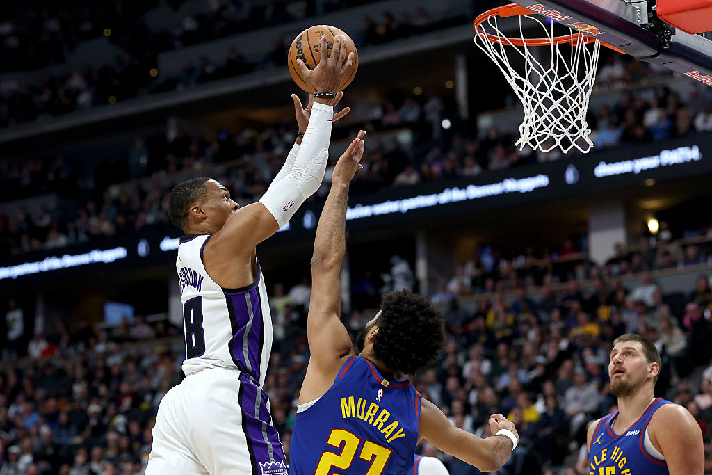 DENVER, COLORADO - NOVEMBER 22: Russell Westbrook #18 of the Sacramento Kings goes to the basket ag...