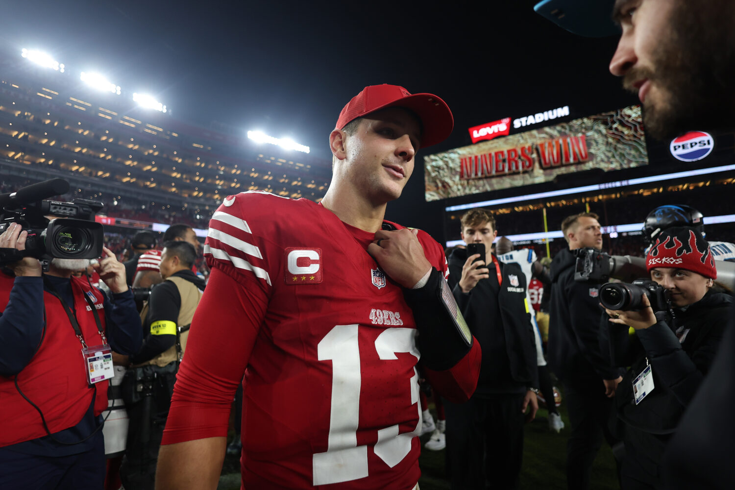 SANTA CLARA, CALIFORNIA - NOVEMBER 24: Brock Purdy #13 of the San Francisco 49ers looks on from the...