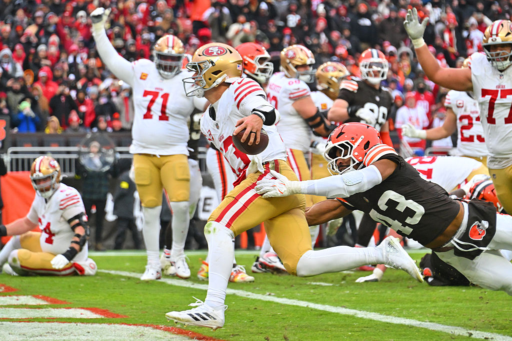 CLEVELAND, OHIO - NOVEMBER 30: Brock Purdy #13 of the San Francisco 49ers runs against Mohamoud Dia...