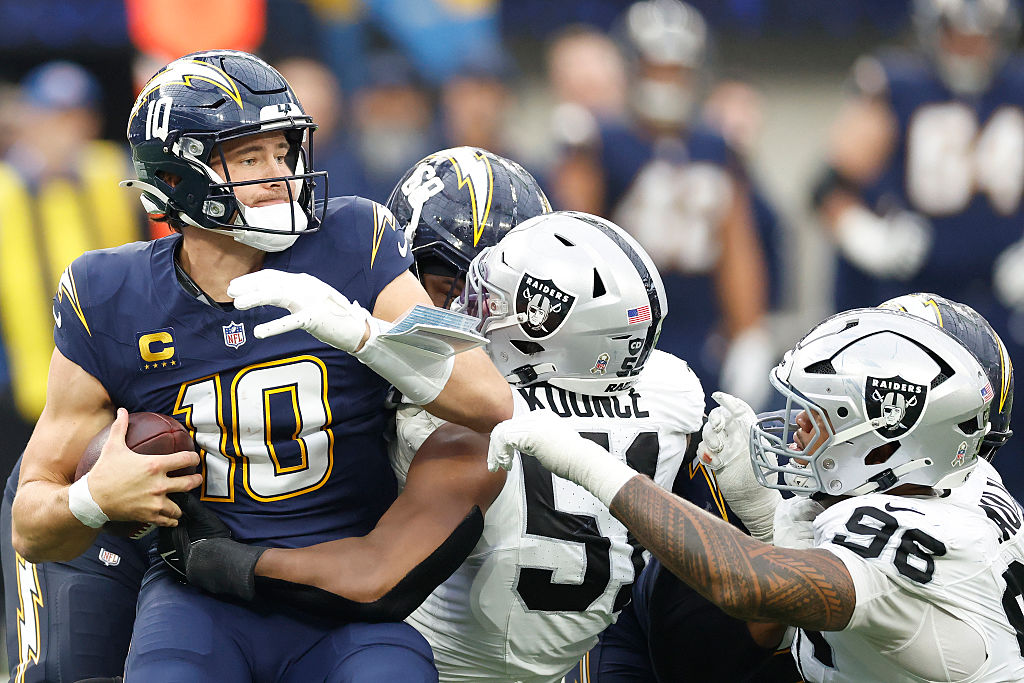 INGLEWOOD, CALIFORNIA - NOVEMBER 30: Malcolm Koonce #51 and Jonah Laulu #96 of the Las Vegas Raider...