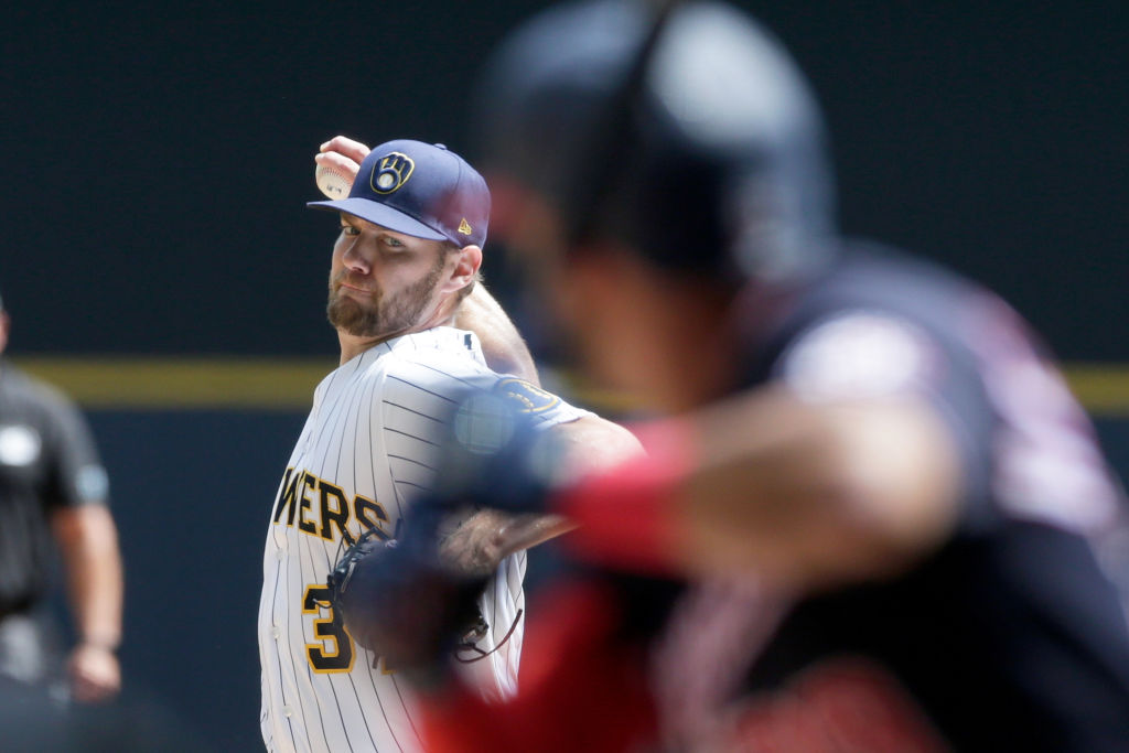 MILWAUKEE, WISCONSIN - AUGUST 22: Adrian Houser #37 of the Milwaukee Brewers throws a pitch in the ...