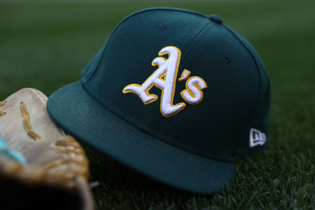 SEATTLE, WASHINGTON - SEPTEMBER 27: A general view of an Oakland Athletics logo and hat before the ...