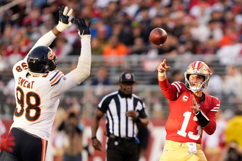 SANTA CLARA, CALIFORNIA - DECEMBER 08: Brock Purdy #13 of the San Francisco 49ers throws a pass ove...
