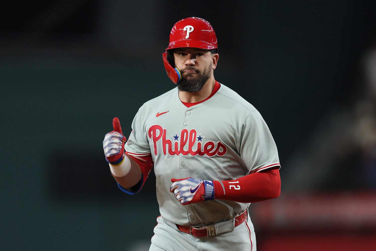 ARLINGTON, TEXAS - AUGUST 08: Kyle Schwarber #12 of the Philadelphia Phillies celebrates toward his...