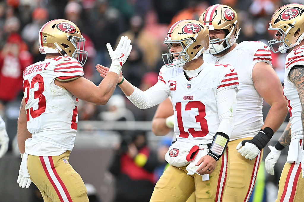 CLEVELAND, OHIO - NOVEMBER 30: Brock Purdy #13 of the San Francisco 49ers celebrates with Christian...