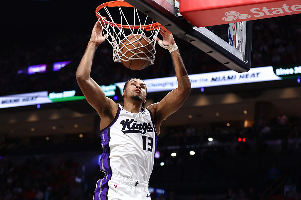 MIAMI, FLORIDA - DECEMBER 06: Keegan Murray #13 of the Sacramento Kings dunks the ball against the ...