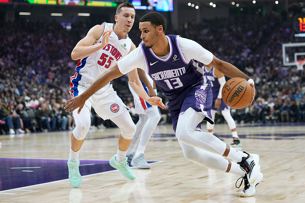 SACRAMENTO, CALIFORNIA - DECEMBER 23: Keegan Murray #13 of the Sacramento Kings looks to drive to t...
