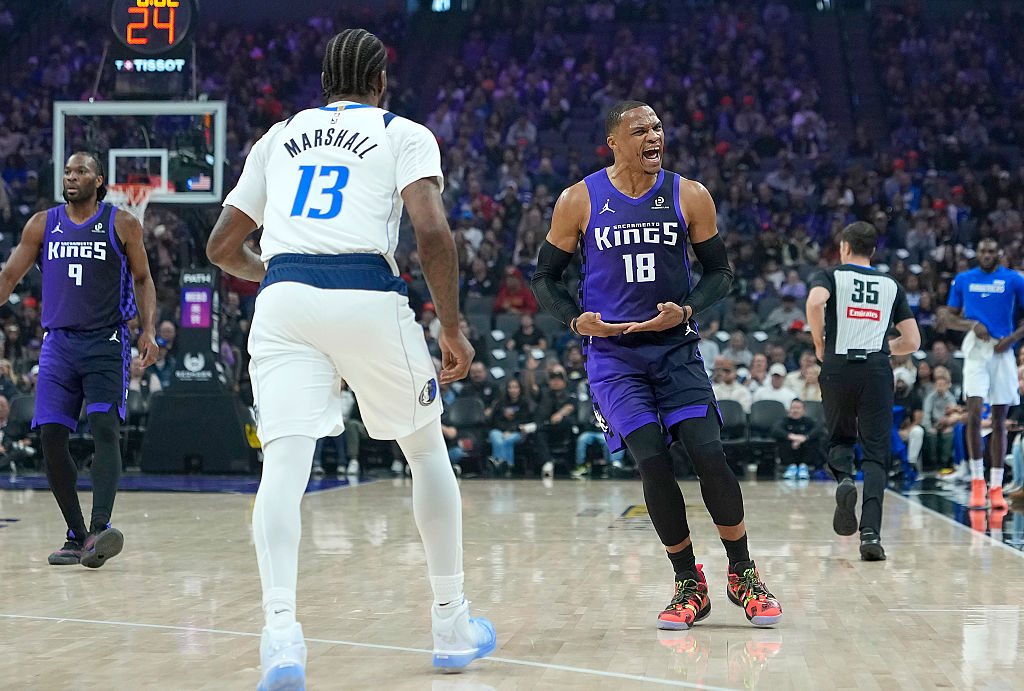 SACRAMENTO, CALIFORNIA - DECEMBER 27: Russell Westbrook #18 of the Sacramento Kings reacts after sc...