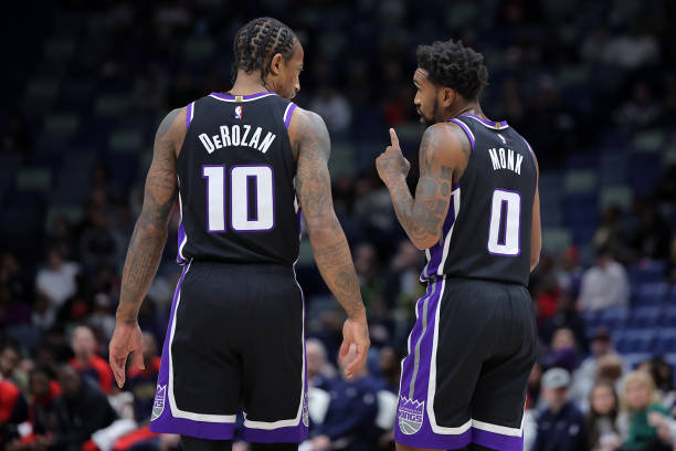 NEW ORLEANS, LOUISIANA - DECEMBER 12: Malik Monk #0 and DeMar DeRozan #10 of the Sacramento Kings r...