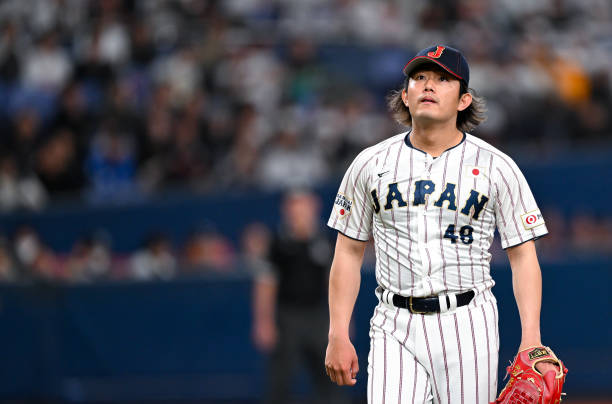 OSAKA, JAPAN - MARCH 05: Tatsuya Imai #48 of Samurai Japan reacts after pitching in the top of the ...