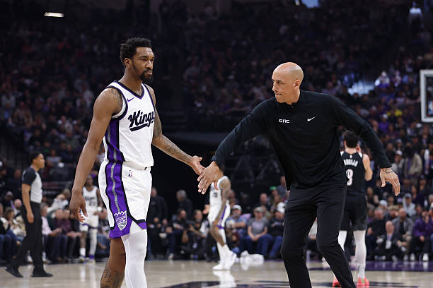 SACRAMENTO, CALIFORNIA - MARCH 27: Sacramento Kings interim head coach Doug Christie and Malik Monk...