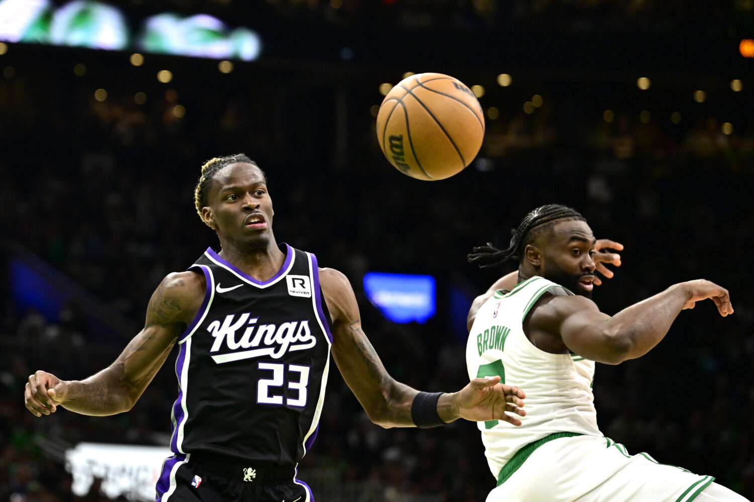 BOSTON, MASSACHUSETTS - JANUARY 10: Jaylen Brown #7 of the Boston Celtics and Keon Ellis #23 of the...