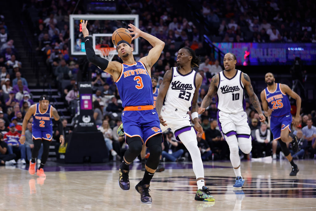 SACRAMENTO, CALIFORNIA - MARCH 10: Josh Hart #3 of the New York Knicks is fouled by Keon Ellis #23 ...