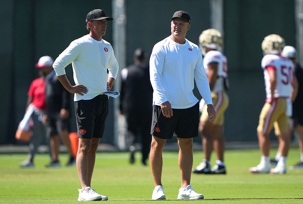 SANTA CLARA, CALIFORNIA - AUGUST 04: Head coach Mike Shanahan (L) and general manager John Lynch (R...