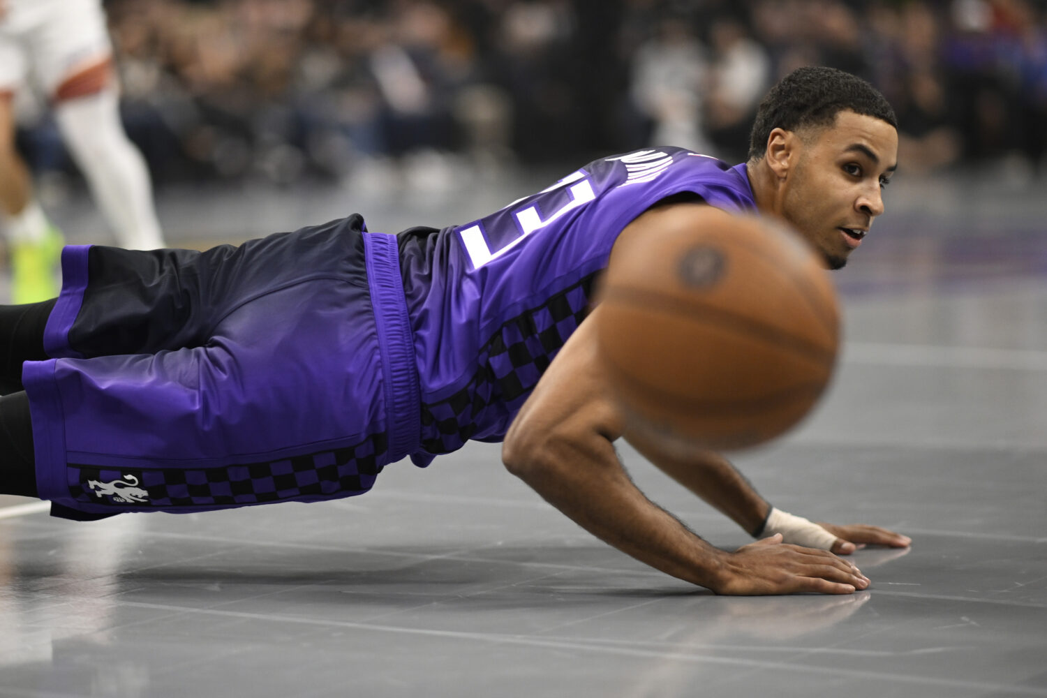 SACRAMENTO, CALIFORNIA - NOVEMBER 26: Keegan Murray #13 of the Sacramento Kings watches the ball go...