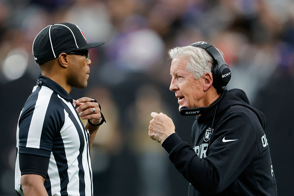 LAS VEGAS, NEVADA - DECEMBER 28: Head coach Pete Carroll of the Las Vegas Raiders speaks with refer...