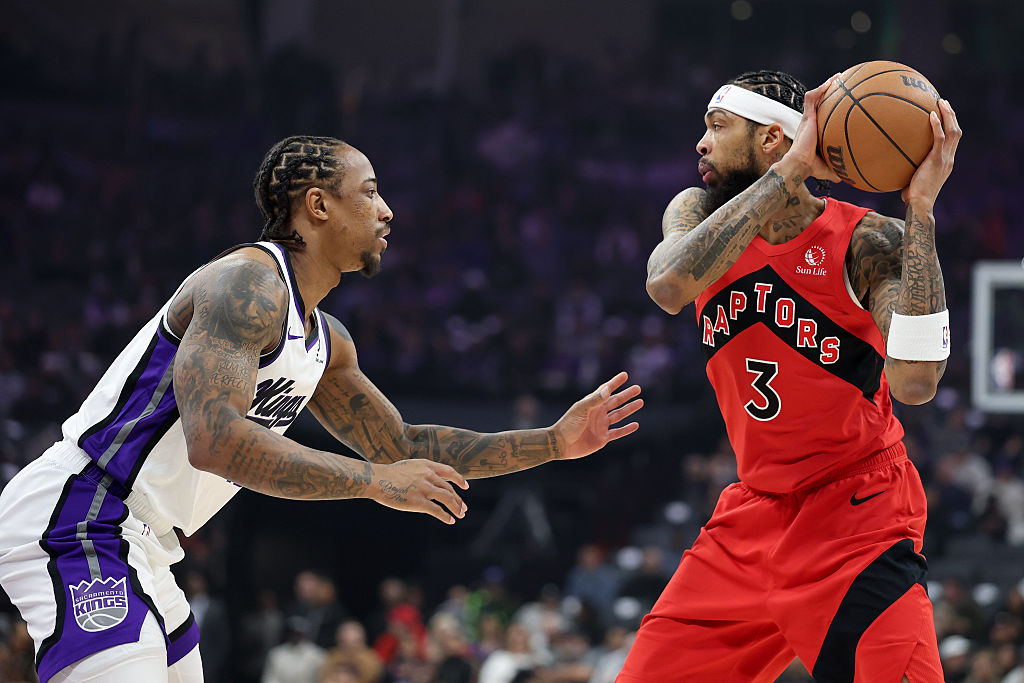 SACRAMENTO, CALIFORNIA - JANUARY 21: Brandon Ingram #3 of the Toronto Raptors is guarded by DeMar D...