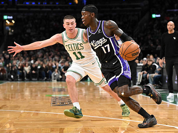 BOSTON, MASSACHUSETTS - JANUARY 30: Dennis Schroder #17 of the Sacramento Kings drives to the baske...