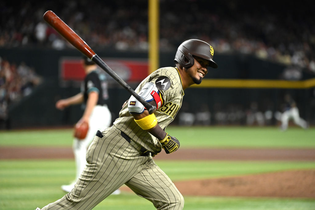 PHOENIX, ARIZONA - MAY 04: Luis Arraez #4 of the San Diego Padres tosses his bat and reacts after h...