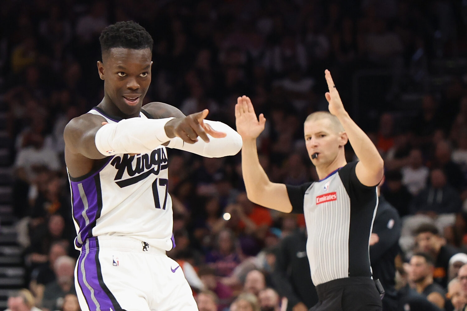 PHOENIX, ARIZONA - OCTOBER 22: Dennis Schroder #17 of the Sacramento Kings reacts after hitting a t...
