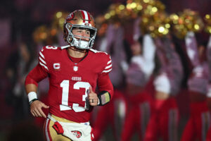 SANTA CLARA, CALIFORNIA - NOVEMBER 24: Brock Purdy #13 of the San Francisco 49ers runs onto the field prior to the game against the Carolina Panthers at Levi's Stadium on November 24, 2025 in Santa Clara, California. (Photo by Thien-An Truong/Getty Images)