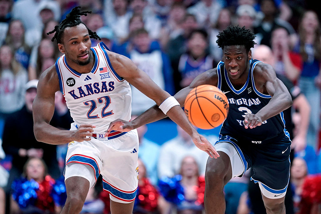LAWRENCE, KANSAS - JANUARY 31: Darryn Peterson #22 of the Kansas Jayhawks and forward AJ Dybantsa #...