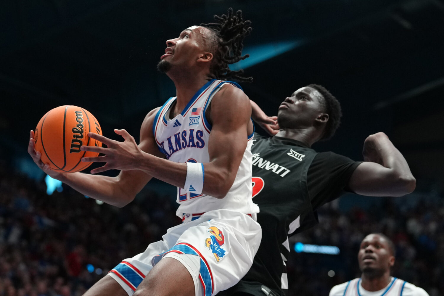 LAWRENCE, KANSAS - FEBRUARY 21: Guard Darryn Peterson #22 of the Kansas Jayhawks lays the ball up a...