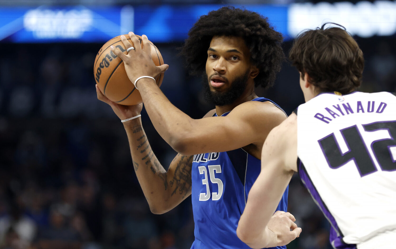 DALLAS, TEXAS - FEBRUARY 26: Marvin Bagley III #35 of the Dallas Mavericks looks to pass as Maxime ...