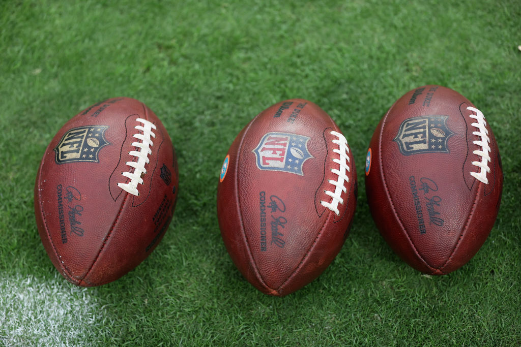 LAS VEGAS, NEVADA - SEPTEMBER 26: Footballs on the field before the NFL game between the Las Vegas ...