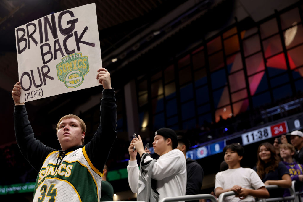 SEATTLE, WASHINGTON - OCTOBER 10: A Seattle Sonics fan holds a sign before the Rain City Showcase i...