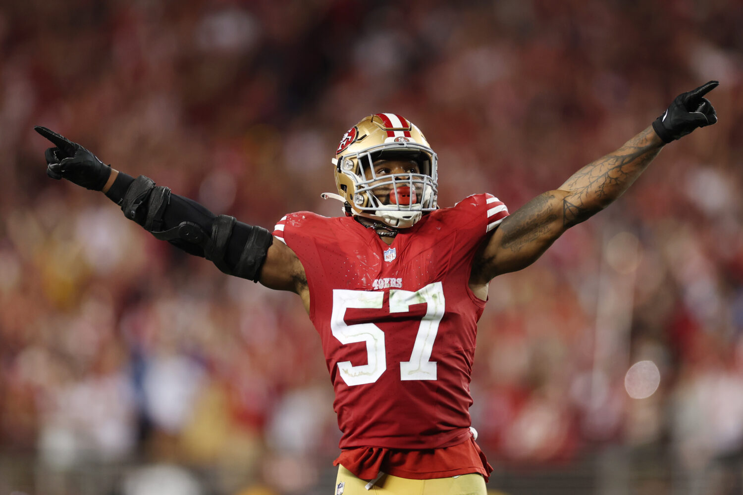 Dre Greenlaw #57 of the San Francisco 49ers celebrates after a stop during the fourth quarter again...