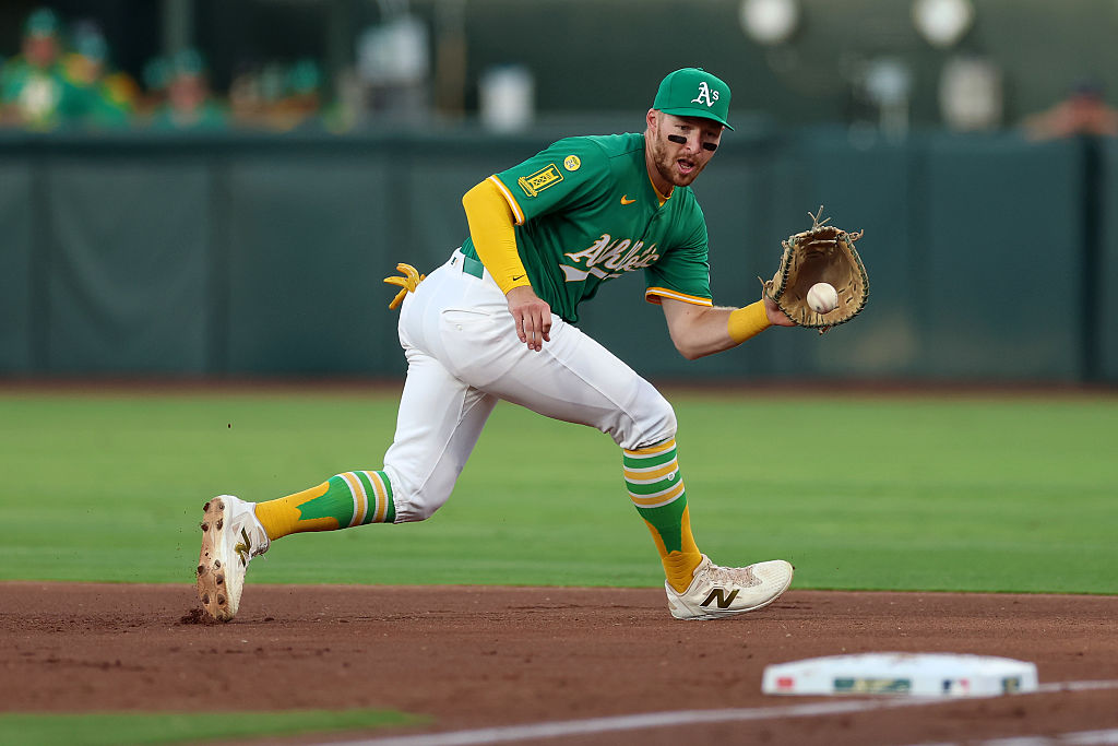 SACRAMENTO, CALIFORNIA - AUGUST 25: Brett Harris #11 of the Athletics fields a ball hit by Zach McK...