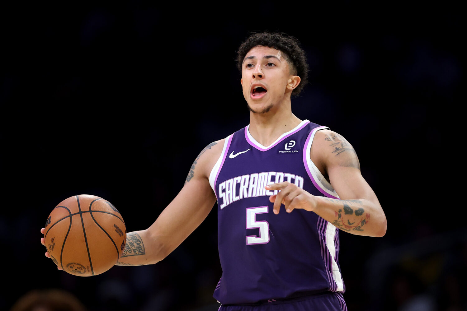 LOS ANGELES, CALIFORNIA - DECEMBER 28: Nique Clifford #5 of the Sacramento Kings in action against ...