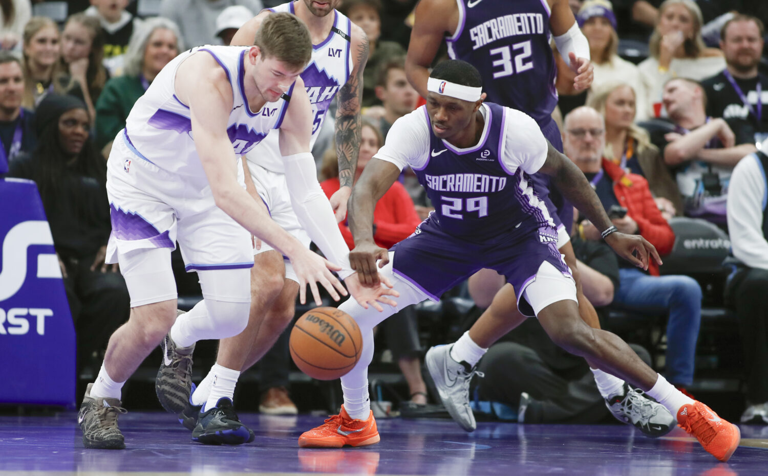 SALT LAKE CITY, UT - FEBRUARY 11: Kyle Filipowski #22 of the Utah Jazz battles for a loose ball wit...